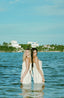 Women's white beachwear cover-ups with lace fabric.