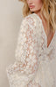 Lace coverup for women with floral pattern.