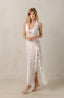 White lace swim cover-ups with leg slit and ruffles.