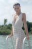 Resortwear swimsuit covers with lace fabric and delicate details.