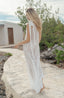 Swimsuit cover with shoulder bow and lace fabric.