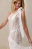 Swimsuit cover ups with lace fabric and bow details.